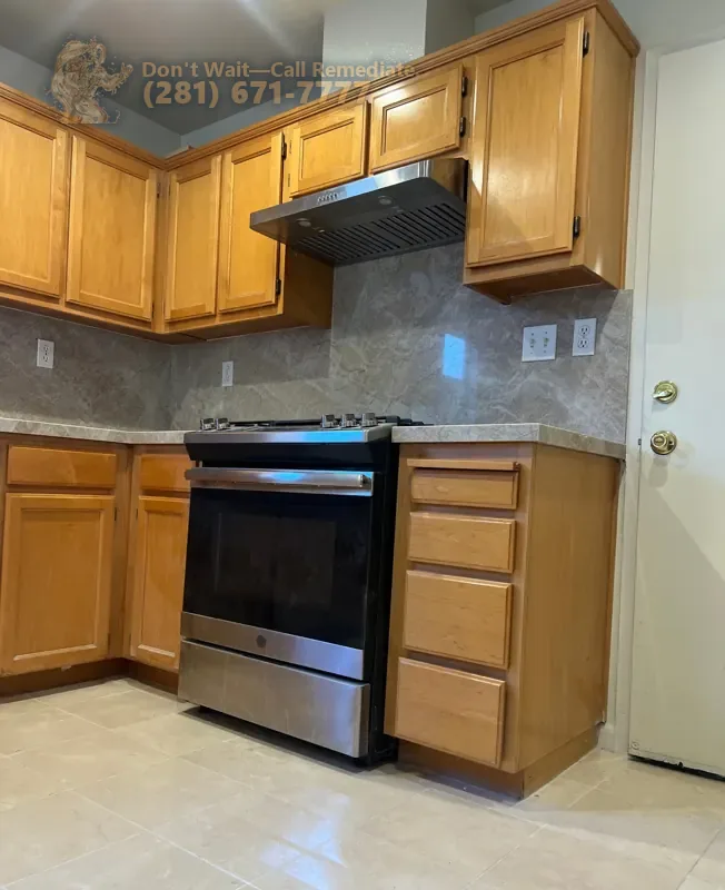 Finished kitchen: oak cabinets, stone backsplash and stainless range