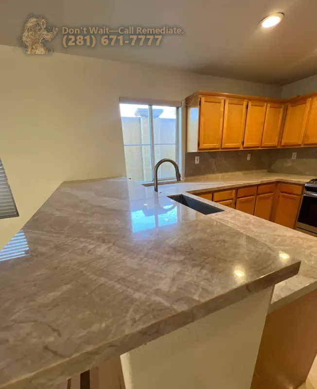 New stone countertop around the sink on the kitchen peninsula